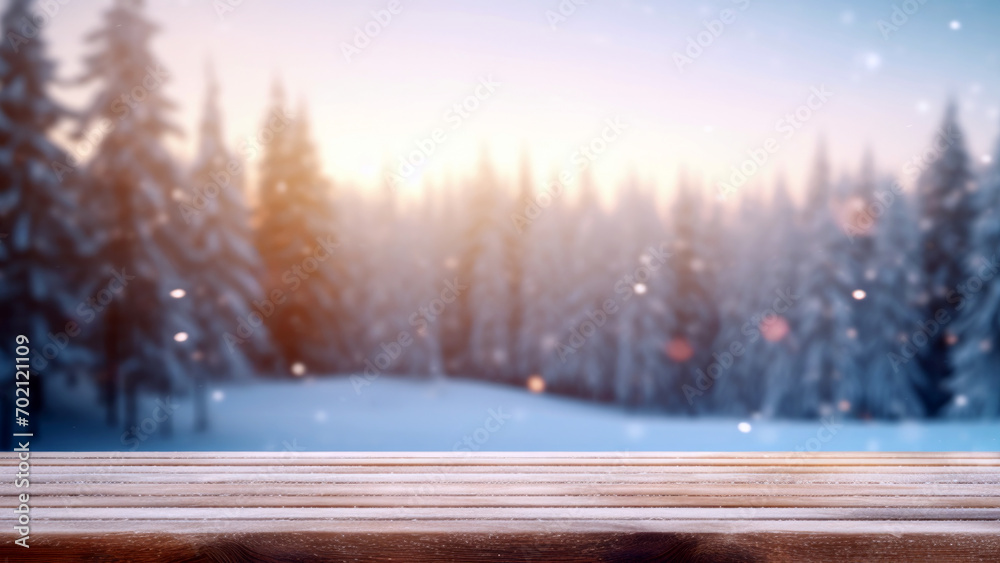 Poster empty wooden table against snowy landscape with bokeh fir trees and snowflakes at sunset background.