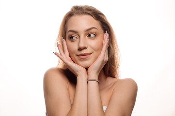 Beauty portrait of pretty blonde girl on white isolated background. Skin care concept