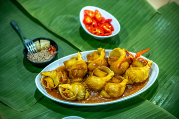 Steamed Spotted Babylon Blanching (Fresh Sea Babylonia Areolata Shell Boiled) served with passion...