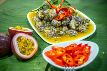 Steamed Spotted Babylon Blanching (Fresh Sea Babylonia Areolata Shell Boiled) served with passion...