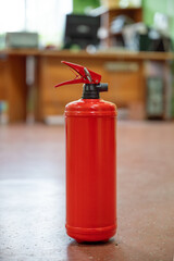 Fire extinguisher in workplace office. The concept of fire safety