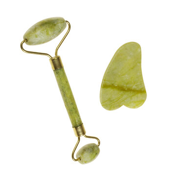 Green jade roller and gua sha stone for facial massage and isolated on transparent background. Facial massage tool. Green quartz jade roller 