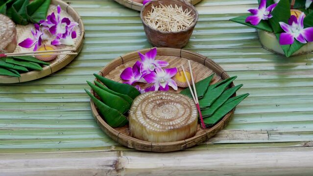 Krathong, the handcrafted floating candle made of floating part decorated with green leaves colorful flowers and many sorts of creative materials for festival Loy Krathong in Thailand