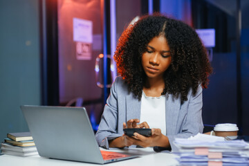 Woman feeling migraine head strain.Overworked businesswoman financier while working on laptop and...