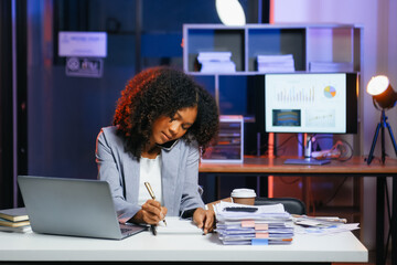 Woman feeling migraine head strain.Overworked businesswoman financier while working on laptop and...