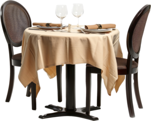 Round restaurant table with a cloth set for two persons