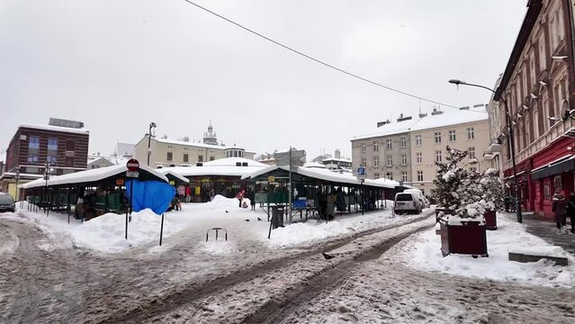 Plac Nowy city market, in the Jewish district. Krakow on a winter, snowy day. Europe