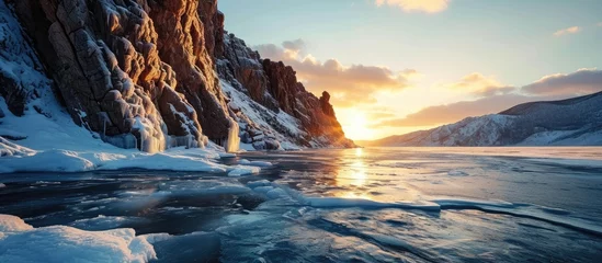 Kussenhoes Beautiful winter landscape of frozen Lake Baikal at sunrise A granite rock with steep slopes rises above a frozen lake Baikal lake Siberia. with copy space image. Place for adding text or design © vxnaghiyev