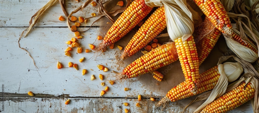 Poster Corn for popcorn on a white background dried corn background top view. with copy space image. Place for adding text or design