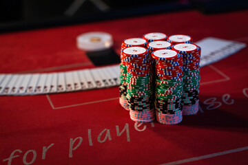 Stacks of Poker Chips and Cards on Casino Table