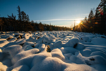 the world's largest stone river in the snow in the rays of the setting sun