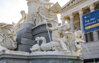 Fototapeta premium The Austrian Parliament Building and the Pallas Athena Fountain in Vienna, Austria