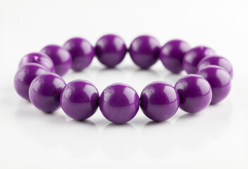  Feminine fashion accessory with amethyst, lilac, and pink beads on white.