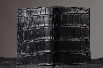 Purse made of genuine black crocodile leather.