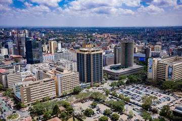 Rolgordijnen Nairobi City County Kenya's Capital Sunset Sunrise Sundowner Golden Hour Cityscapes Skyline Skyscrapers Landscapes Tall Building Landmarks In Kenya East Africa Aerial Tower High-rise Modern City House © Antony Trivet