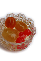 Italian Mostarda di Cremona with candied fruits in a glass bowl isolated on white backgrund. Traditional Italian mustard 