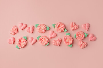 Sweet tender background, roses and hearts from meringue on pink pastel background. Holiday concept, Saint Valentine, love, Mother Mom day, confectionery invitation, banner for your site 