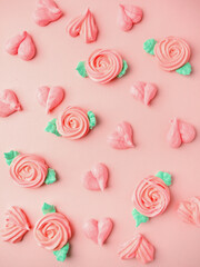 Sweet tender background, roses and hearts from meringue on pink pastel background. Holiday concept, Saint Valentine, love, Mother Mom day, confectionery invitation, banner for your site