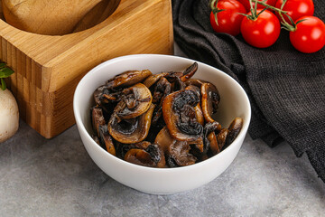 Roasted champignon mushrooms in the bowl