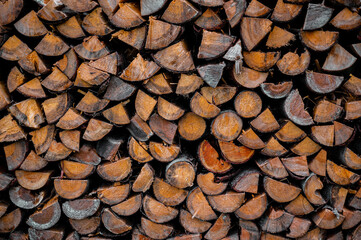 Wooden brown background. Background made of logs, tree in section.