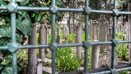 The historic tombstones in the Traditional Islamic Ottoman style in Eyup cemetery, Istanbul, Turkiye