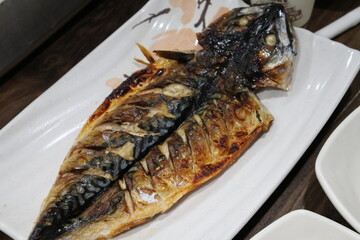 Korean food. Grilled mackerel on a plate