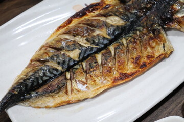 Korean food. Grilled mackerel on a plate