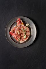 Veal steak on grey dark surfage.