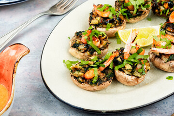 Baked stuffed mushroom caps with prawns