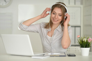 Young beautiful girl working on her laptop
