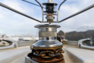 Obraz premium Yacht anchor gear on sailing boat. Capstan with anchor chain. Anchoring. Yachting concept.