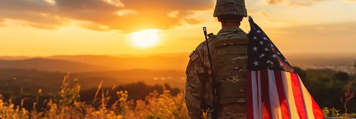 A soldier stands proudly holding an American flag against a setting sun. Silhouette of a soldier looking at the horizon with warm sunset tones. Concept of patriotism