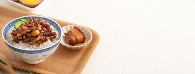 Braised pork belly meat over cooked rice, famous and delicious street food in Taiwanese restaurant.
