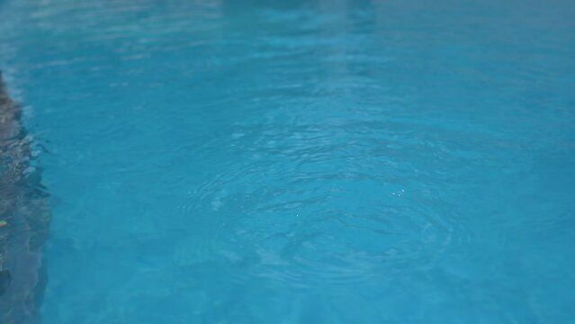 The texture of the turquoise water in the pool.