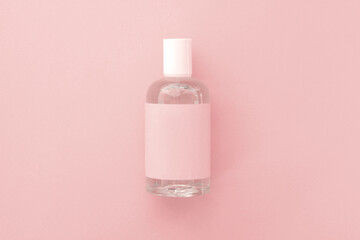 one bottle of perfume against the pink background