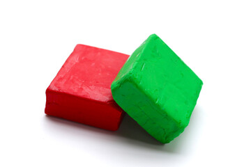 Colorful plasticine clay on white background.