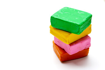 Colorful plasticine clay on white background.