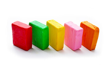 Colorful plasticine clay on white background.