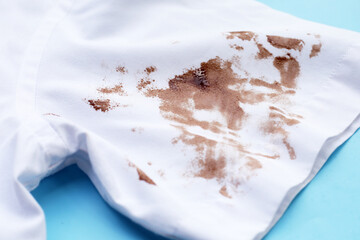 Dirty choclate stain on white shirt