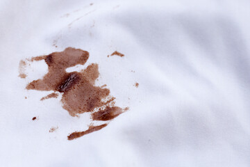 Dirty choclate stain on white shirt