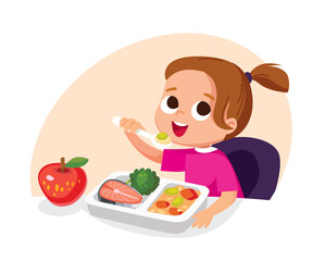Girl eating healthy eco food with spoon sitting at the table. Child having meal for breakfast, lunch. Girl eats apple for supper, dinner or snack. Hungry kid have a meal. Meals are served to child.