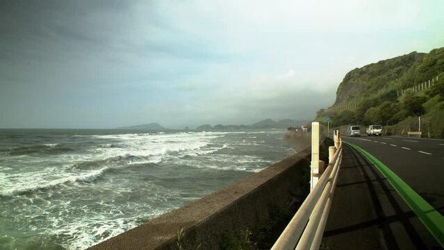 Waves breaking along coastal highway Nichinan Miyazaki Japan