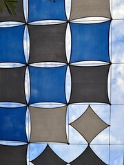 abstract background from looking through the blue sail-shaped sunshade
