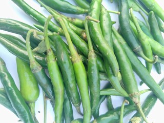 Green chillies are shown as a sample with  white backgrounds giving a great view.