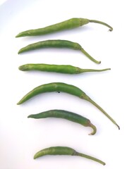 Green chillies are shown as a sample with  white backgrounds giving a great view.