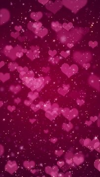 Vertical video - cute pink hearts, shiny stars and glowing glittering particles on dark red gradient background. This shiny romantic Valentine's Day background is full HD and a seamless loop.