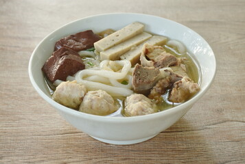 Vietnamese rice noodles or Pho with slice sausage and chop pork couple blood in soup on bowl 