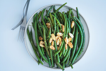 Grilled green beans with almonds and lemon zest.