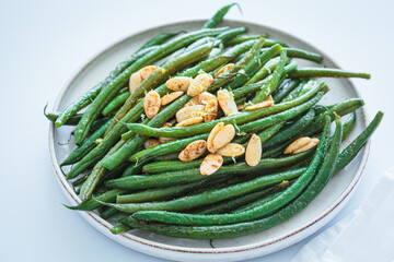 Grilled green beans with almonds and lemon zest.