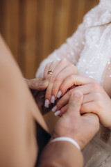 Closeup view of married couple holding hands